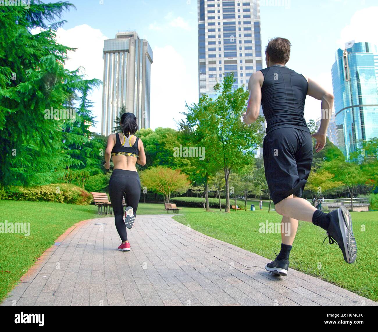 Healthy sports people trail running living an active life. Stock Photo