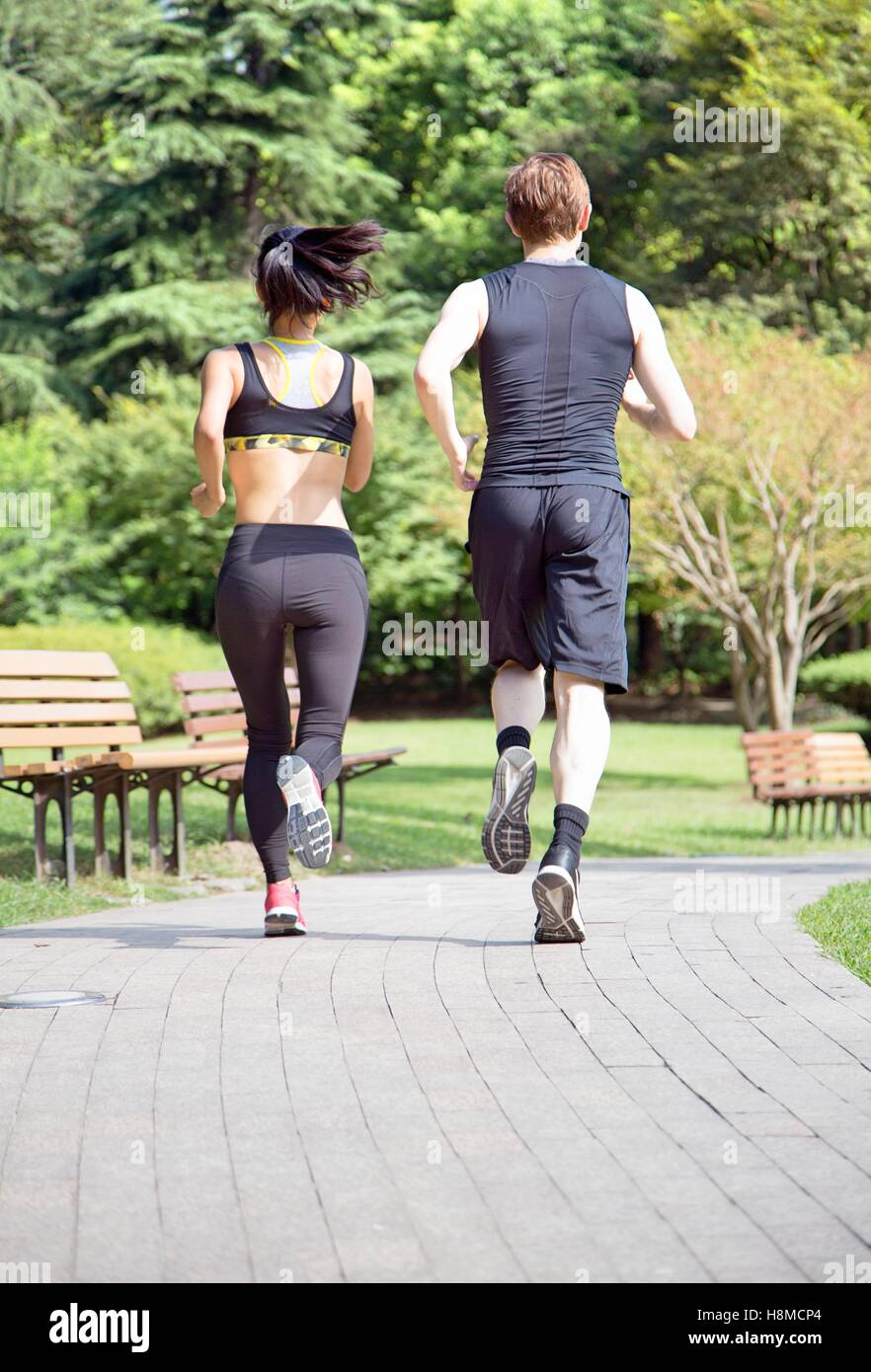 Healthy sports people trail running living an active life. Stock Photo
