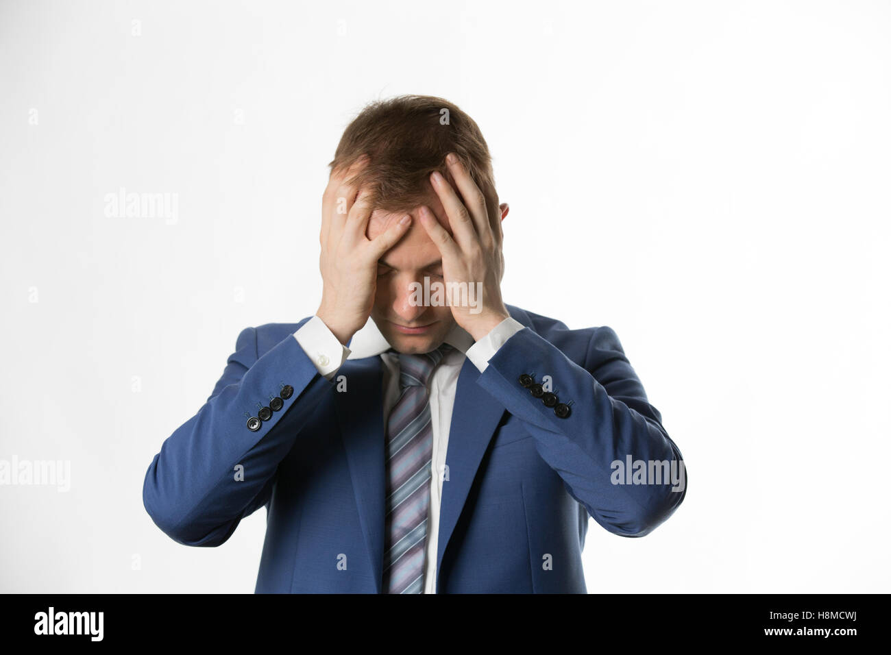depressed businessman with holding his head in hands Stock Photo - Alamy