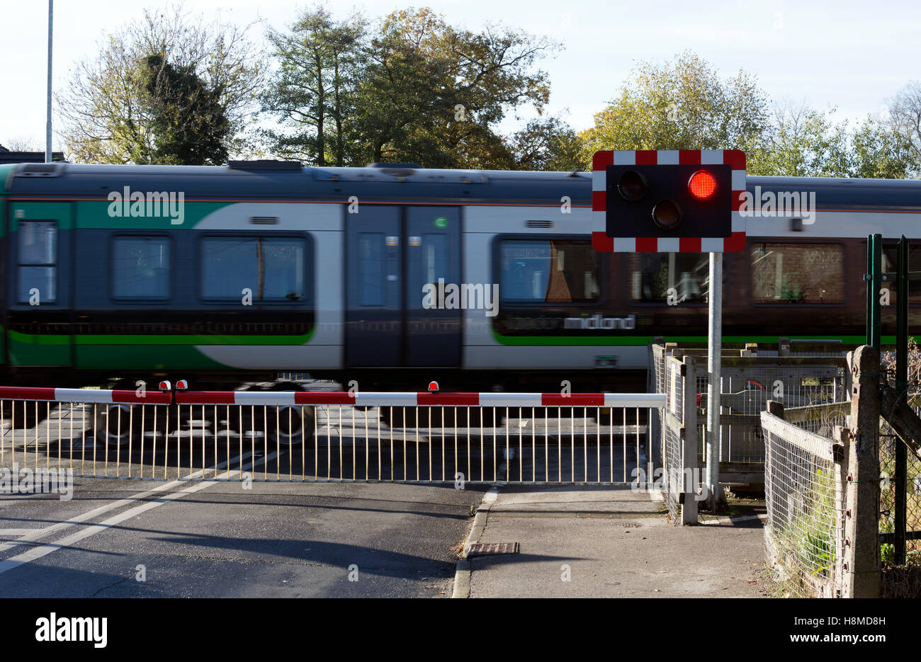 London Midland train at Bentley Heath level crossing, West Midlands, England, UK Stock Photo