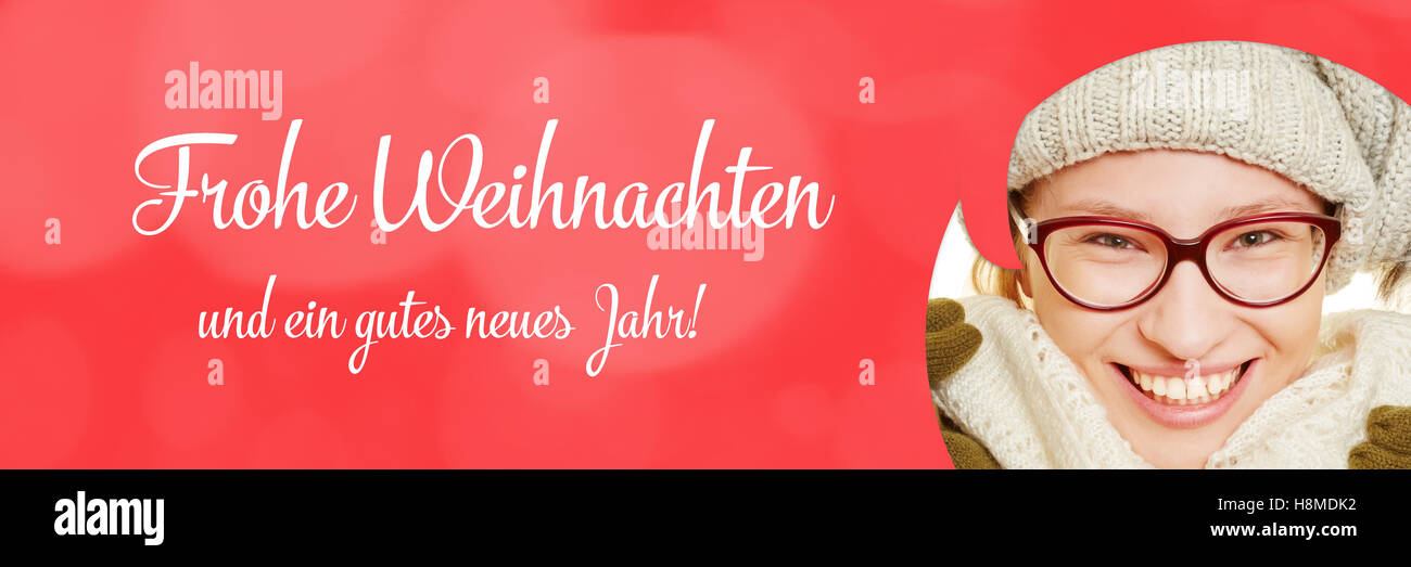 Christmas card with woman and german slogan 'Frohe Weihnachten und ein gutes neues Jahr!' (Merry christmas and a happy new year) Stock Photo