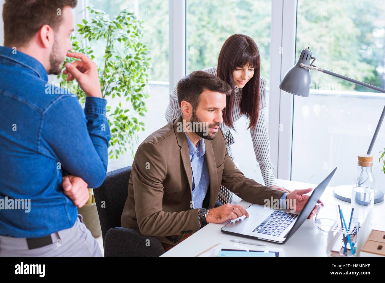Men and women working in office Stock Photo