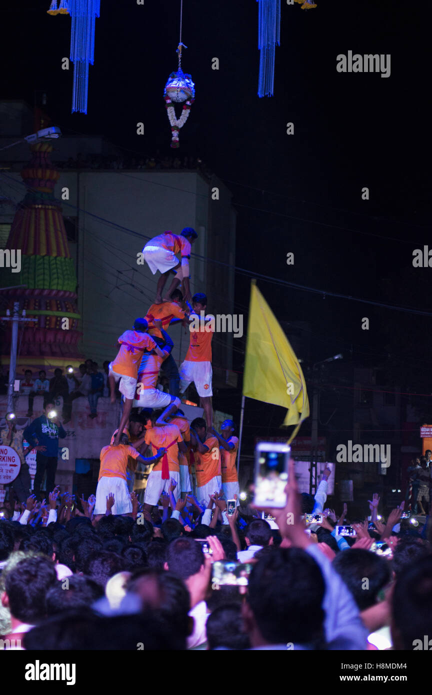 Human pyramid breaking dahi handi on janmashtami festival, Pune Stock