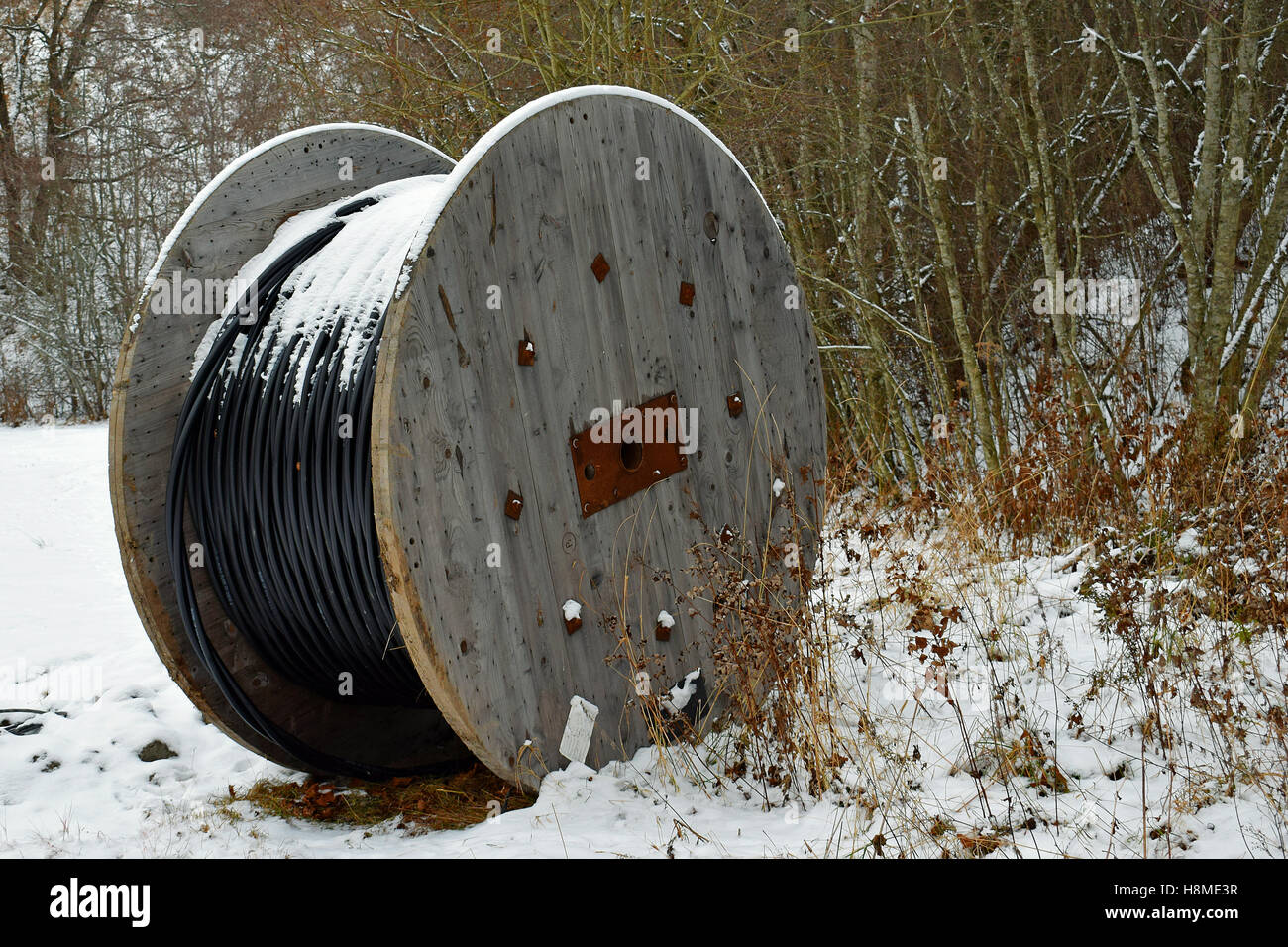 Cable spool after first snow Stock Photo