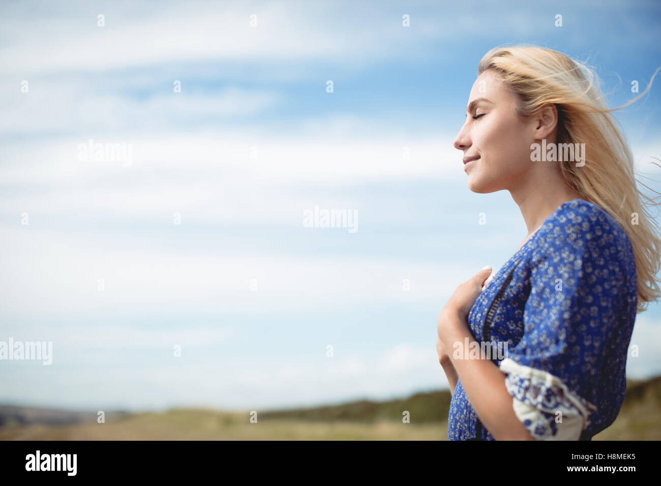 Carefree woman in field hi-res stock photography and images - Alamy