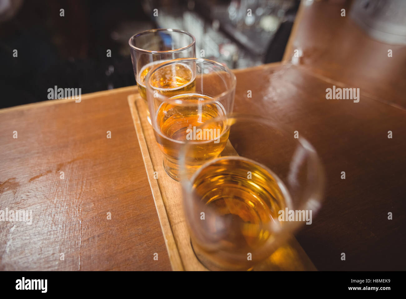 Close-up of beer glasses on the counter Stock Photo
