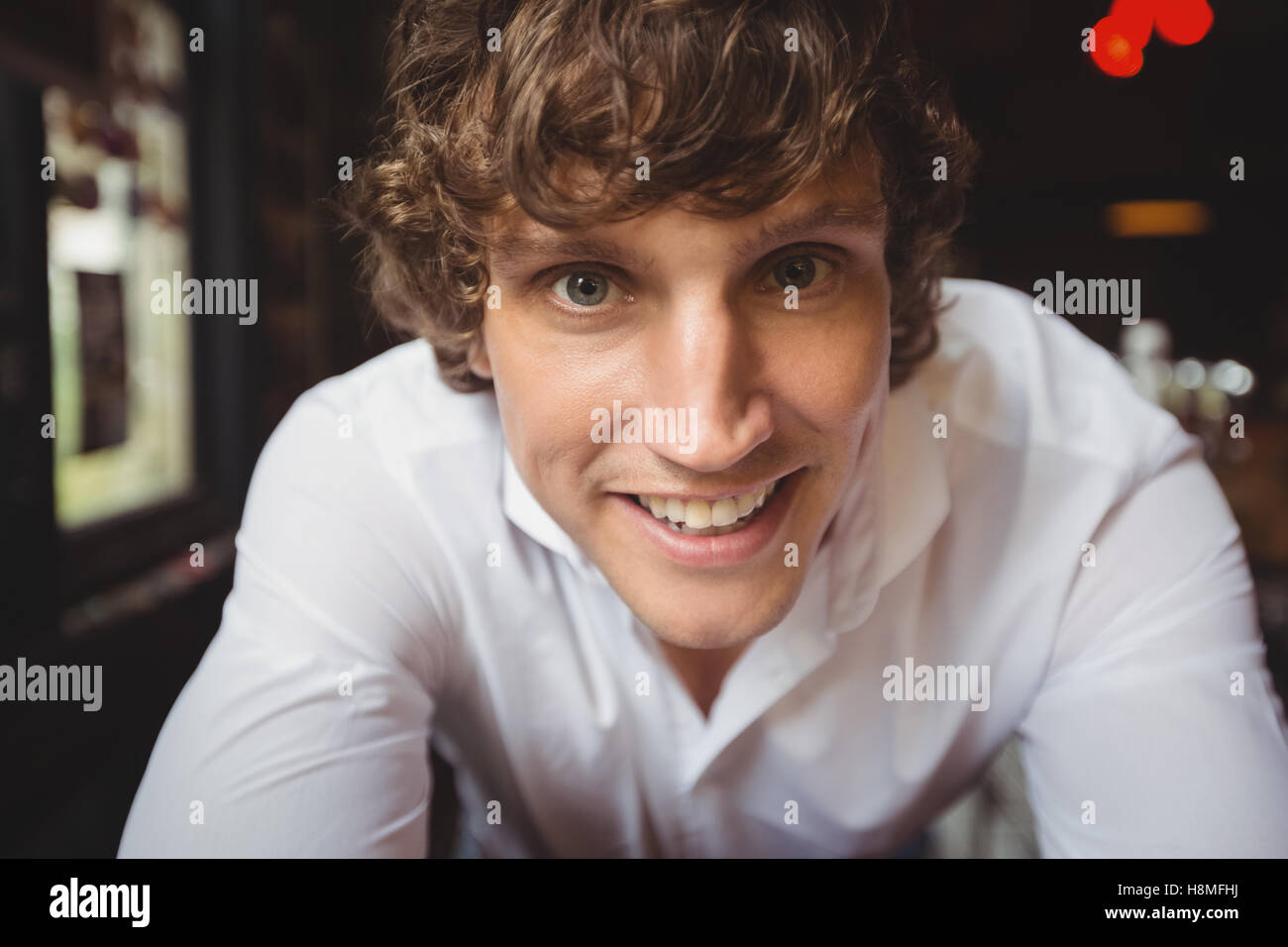 Portrait of bartender smiling at camera Stock Photo Alamy