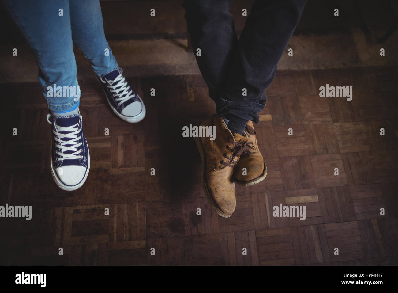 Couple feet wearing canvas shoes Stock Photo Alamy