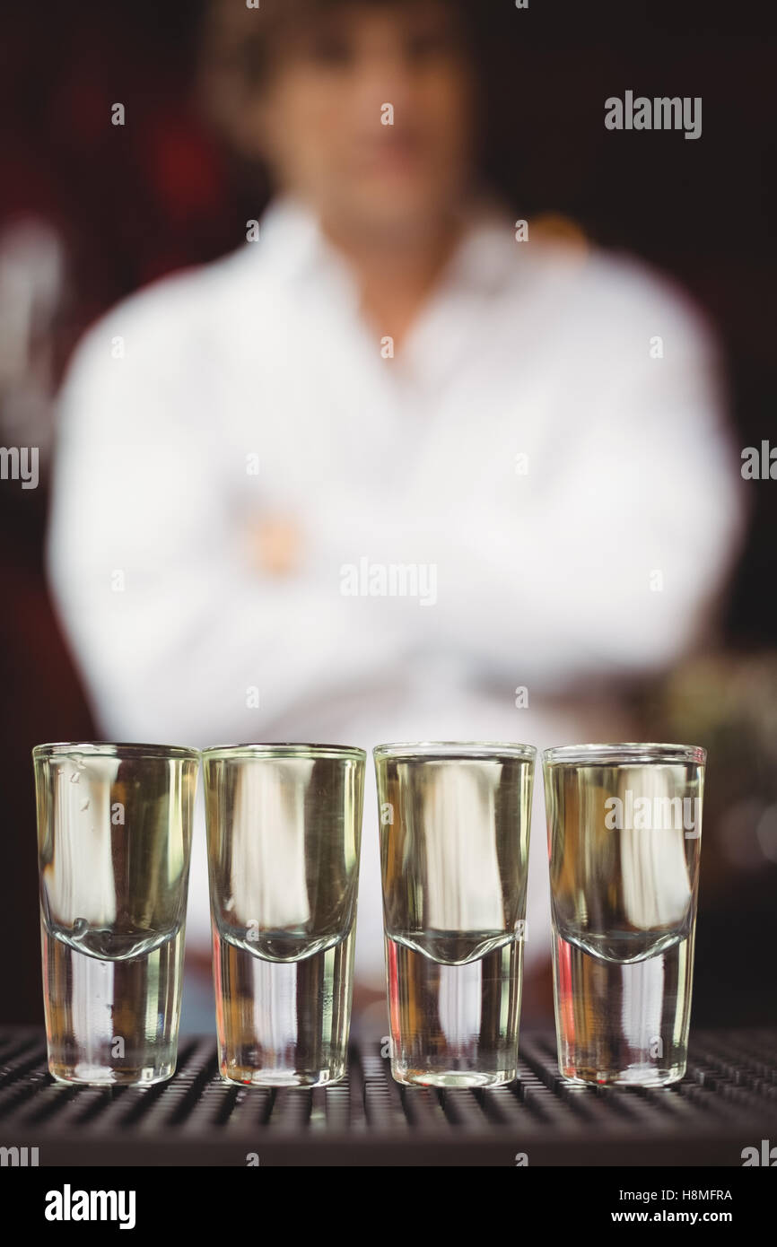 Close-up of tequila in shot glasses on bar counter Stock Photo
