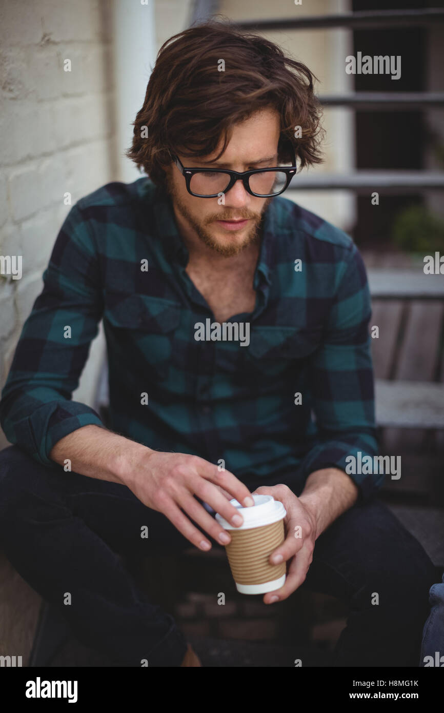 Young man casual sitting on stairs hi-res stock photography and images ...