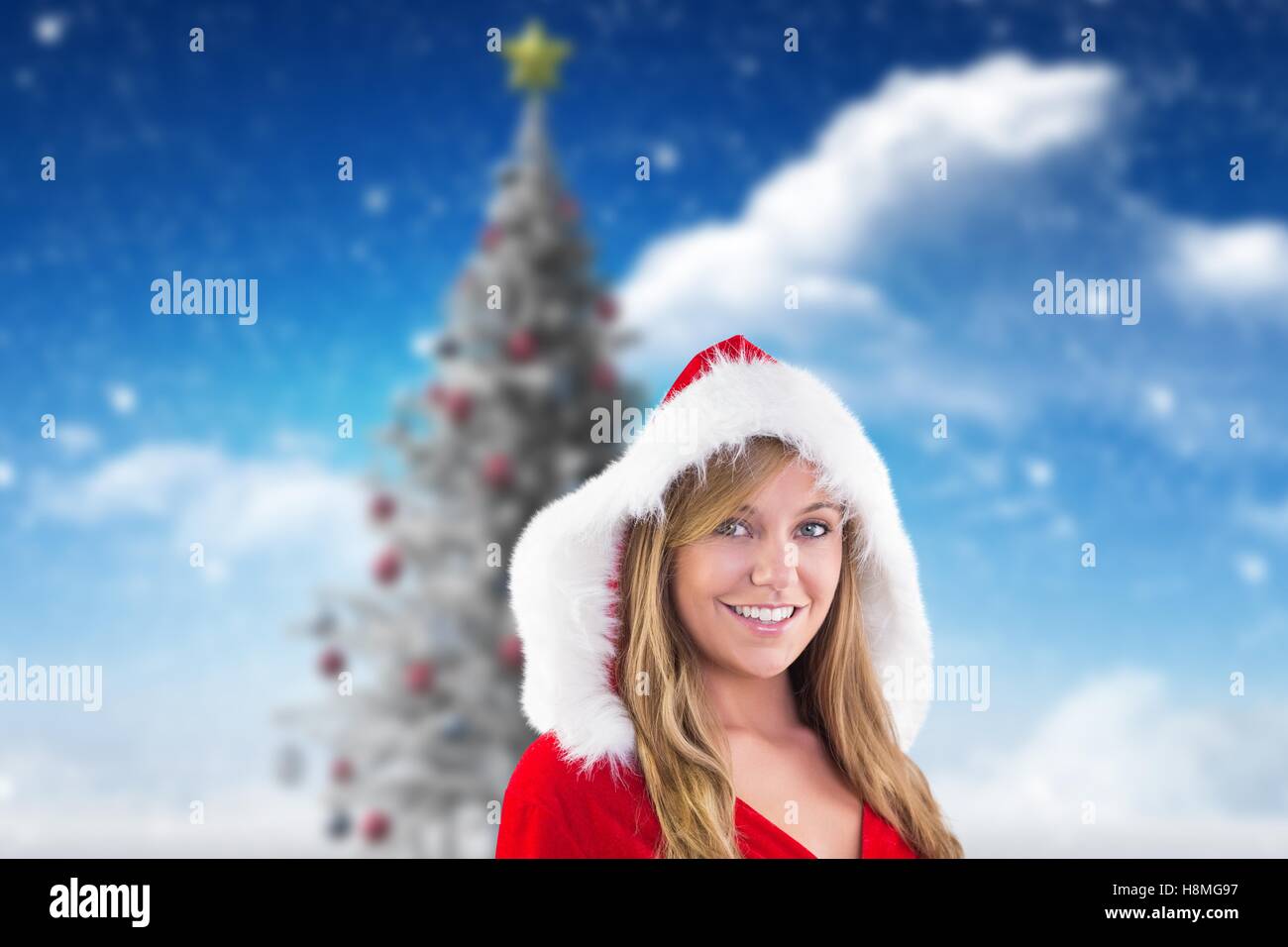 Beautiful woman in santa costume smiling at camera Stock Photo