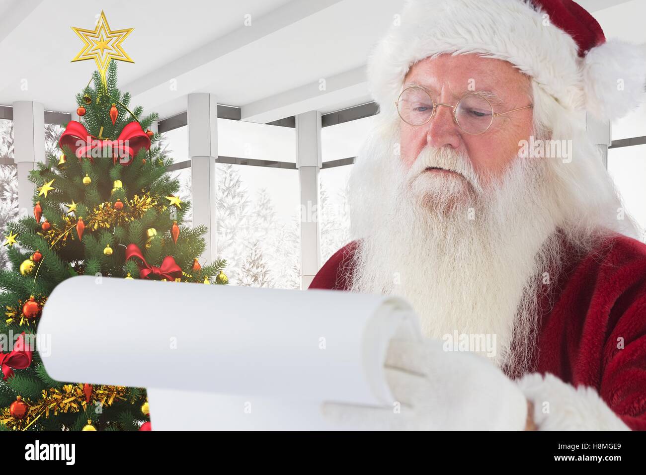 Santa claus reading christmas letter Stock Photo