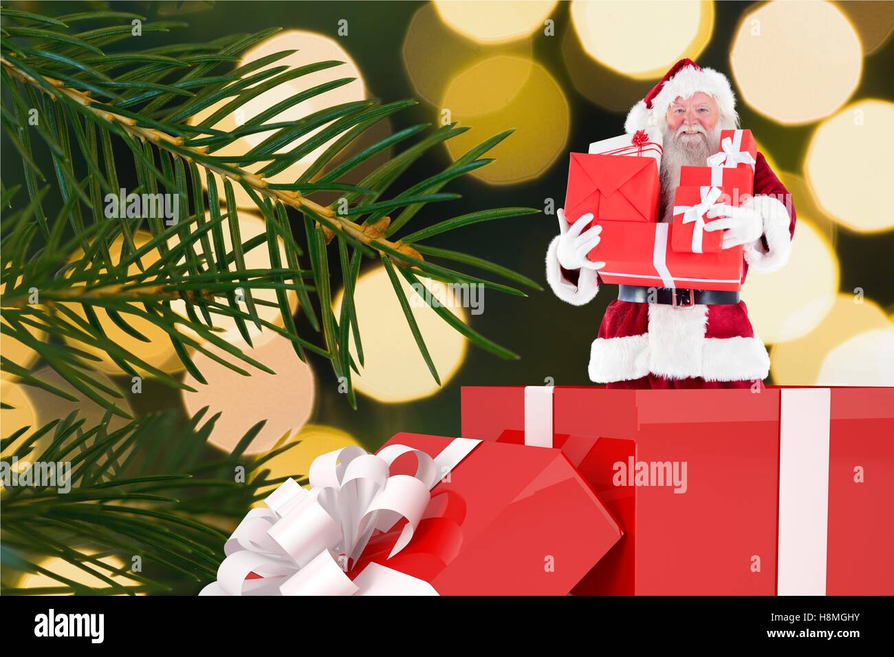 Santa claus figurine with christmas gifts Stock Photo