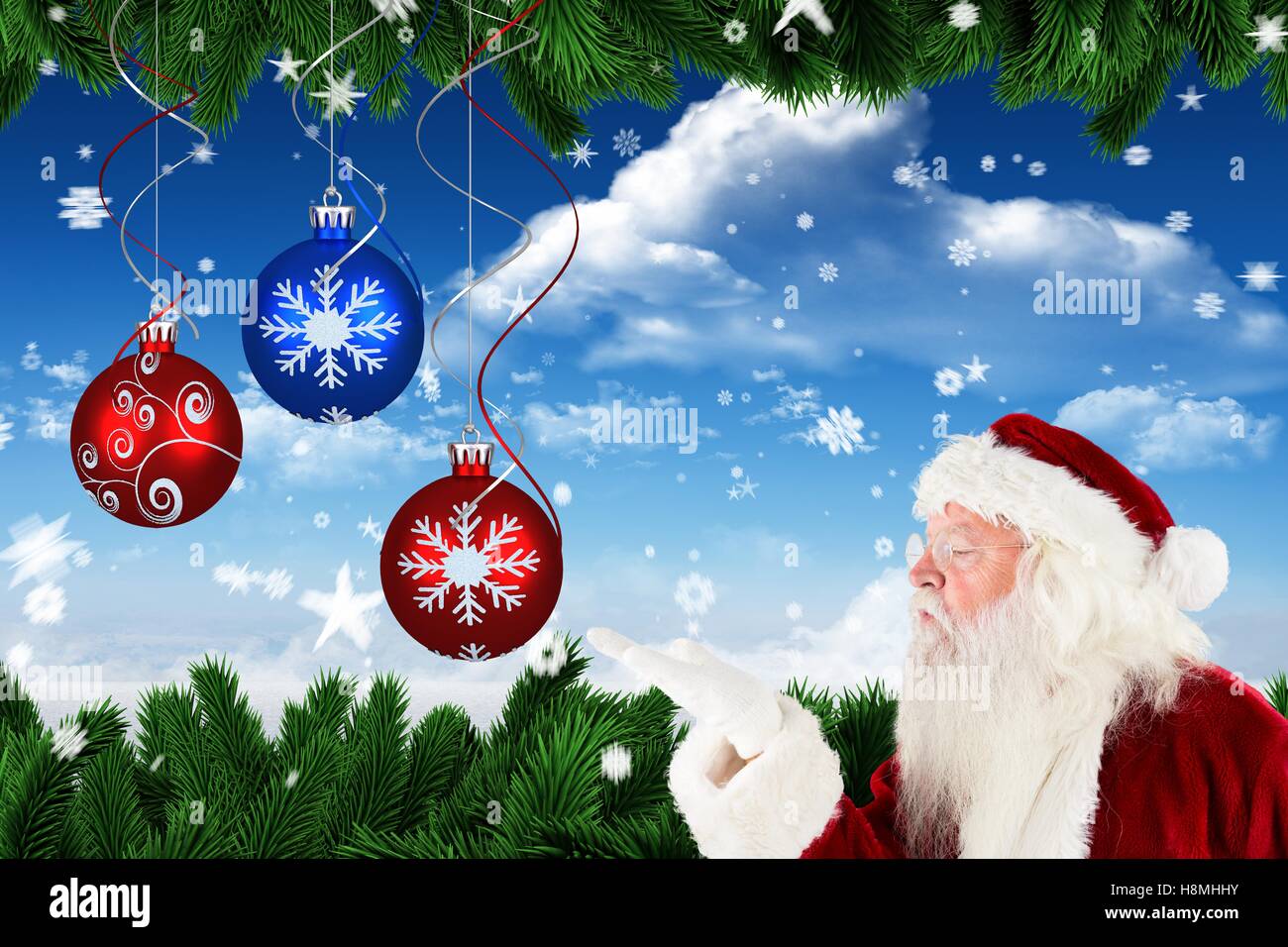 Santa claus blowing a snowflake Stock Photo