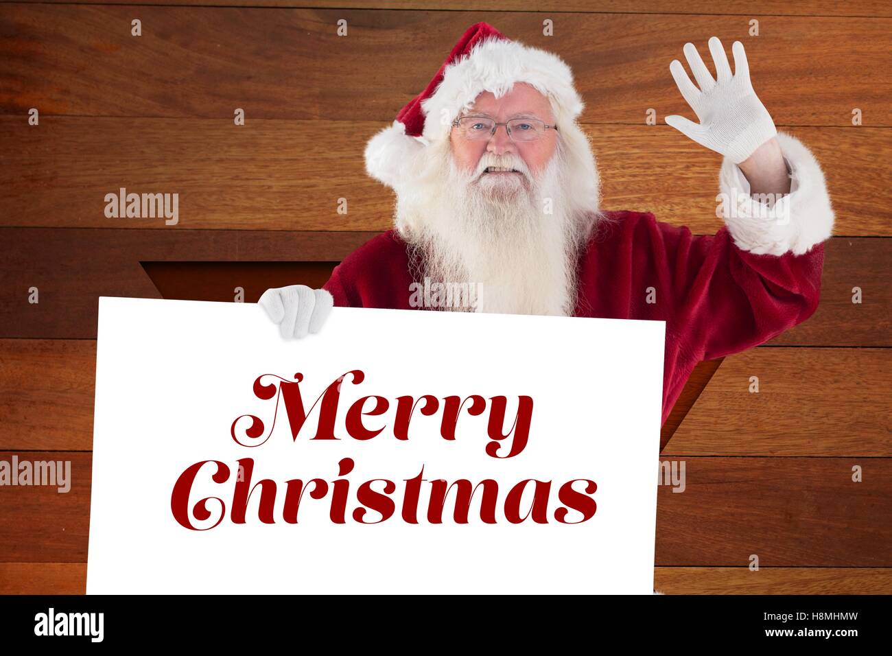 Portrait of santa claus holding christmas greeting Stock Photo - Alamy