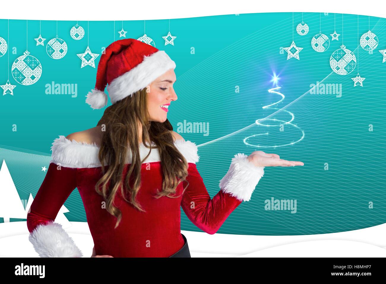 Beautiful woman in santa costume gesturing agianst digitaly generated background Stock Photo