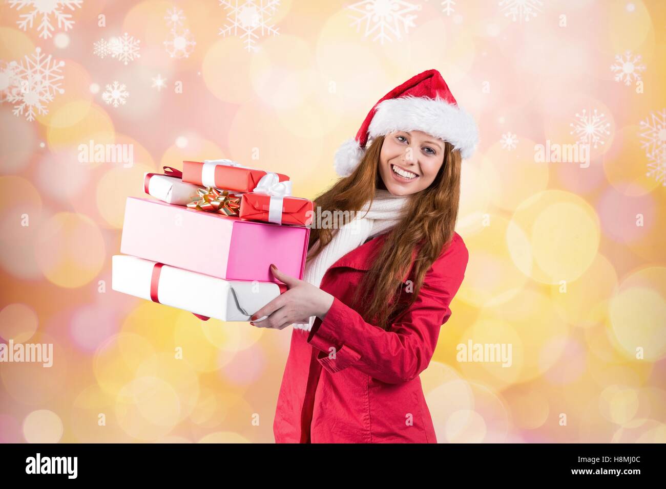 Beautiful woman in santa costume holding a christmas gift Stock Photo ...
