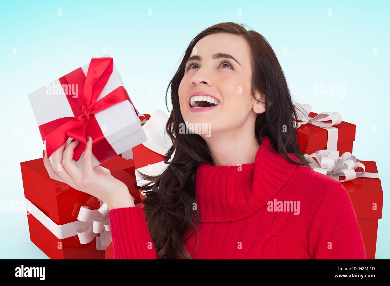 Happy woman holding christmas gifts Stock Photo - Alamy