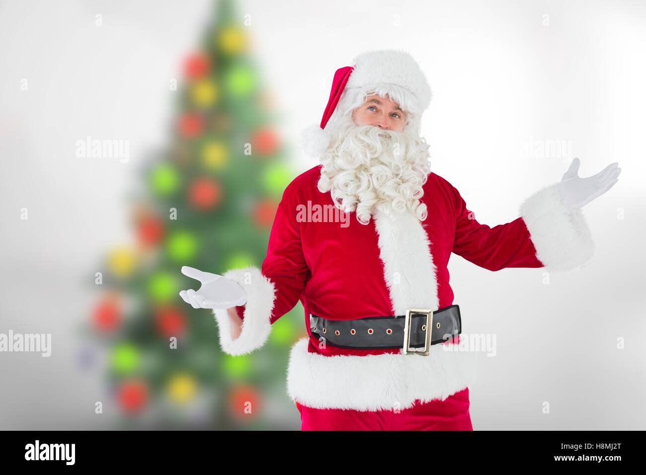 Santa claus gesturing against blur background Stock Photo