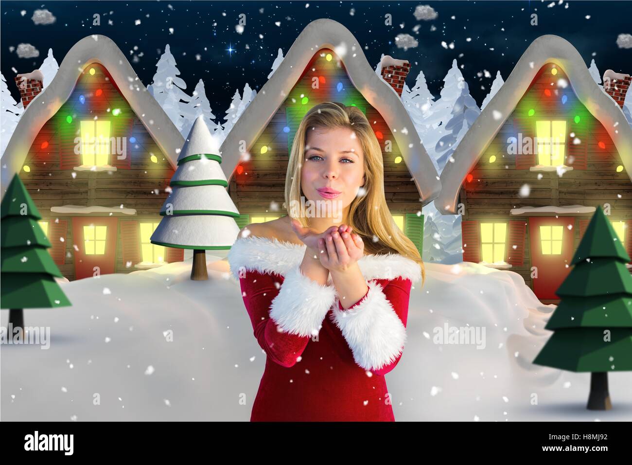 Beautiful woman in santa costume blowing a kiss against digitally generated background Stock Photo