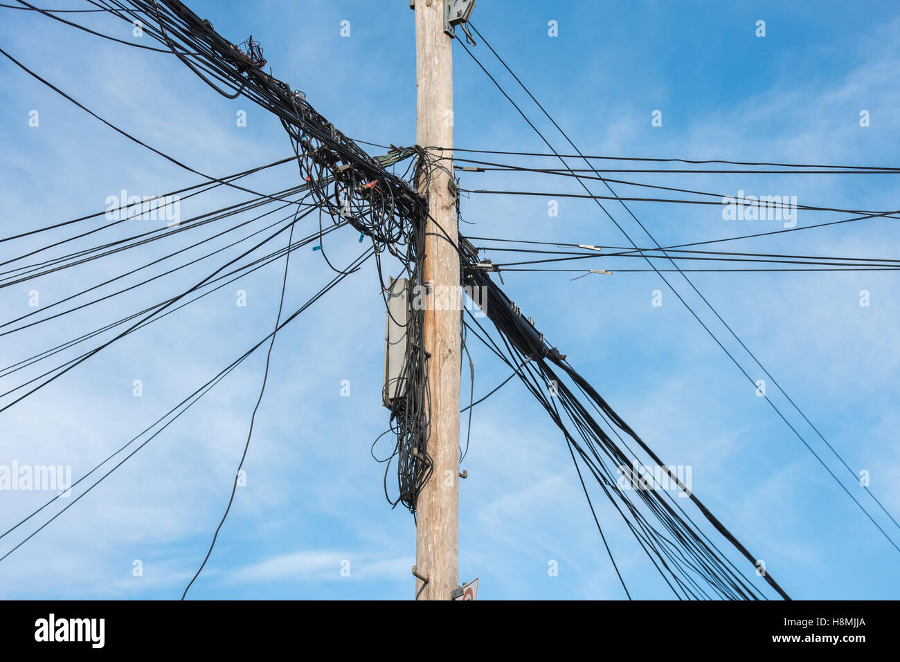 Telephone pole with cable wires Stock Photo