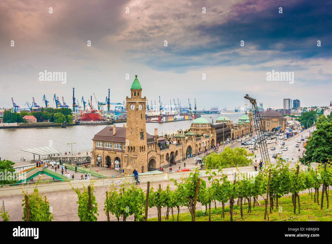 Famous Hamburger Landungsbrücken with commercial harbor and Elbe river, St. Pauli district, Hamburg, Germany Stock Photo