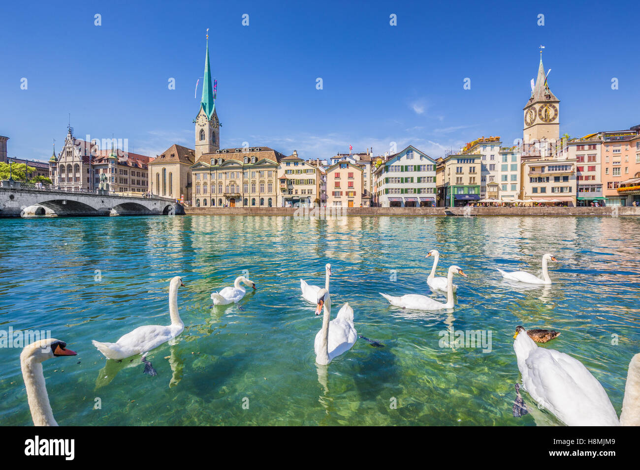 Historic city center of Zurich with famous Fraumunster Church and swans on river Limmat, Canton of Zurich, Switzerland Stock Photo