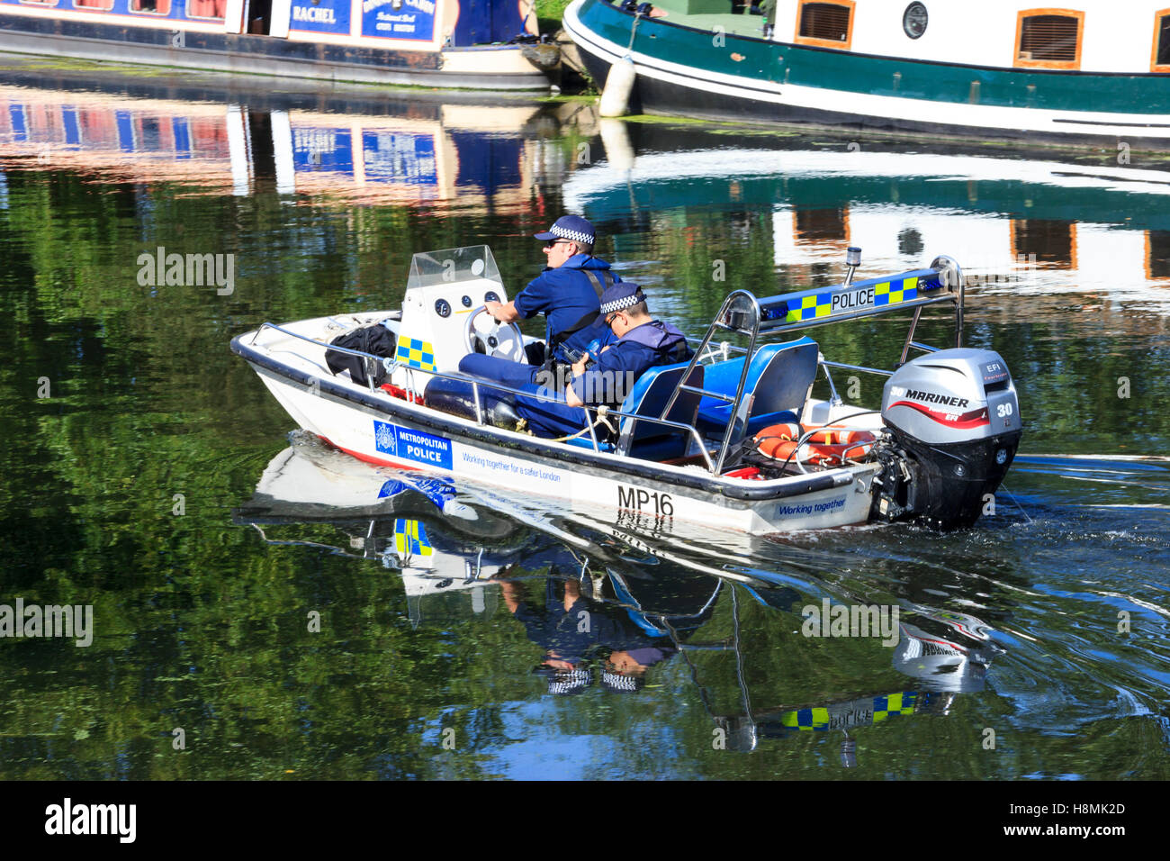 River Police in a motor launch on the River Lea at Upper Clapton, London, UK Stock Photo