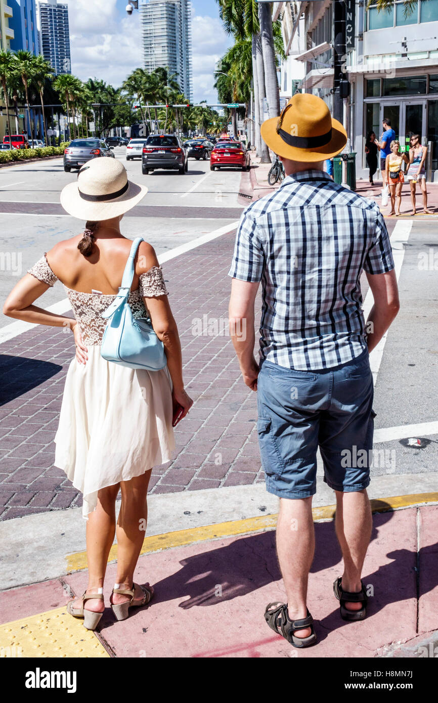 Miami Beach Florida,adult,adults,man men male,woman women female lady,couple,well dressed,wearing,fedora,visitors travel traveling tour tourist touris Stock Photo