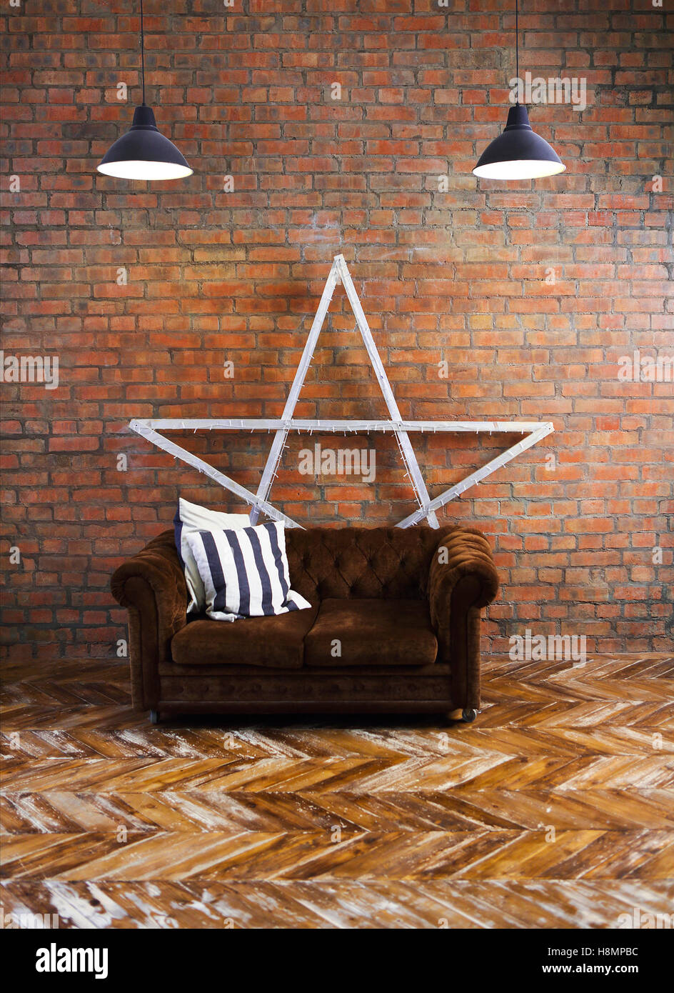 Interior of loft with velvet sofa and lamps. Copy space Stock Photo Alamy