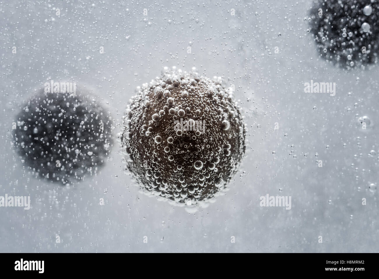 round chocolate in the water with bubbles. seamless texture Stock Photo