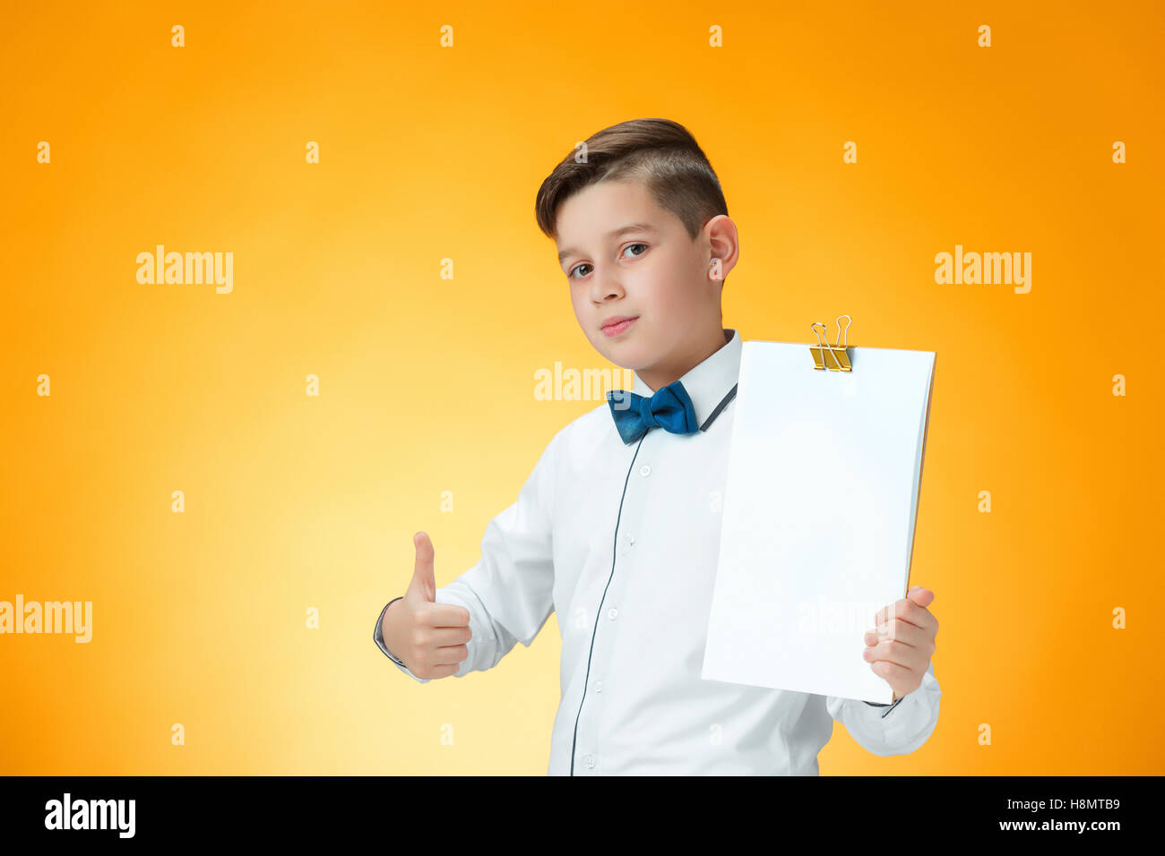 Happy boy showing thumbs up sign OK Stock Photo - Alamy