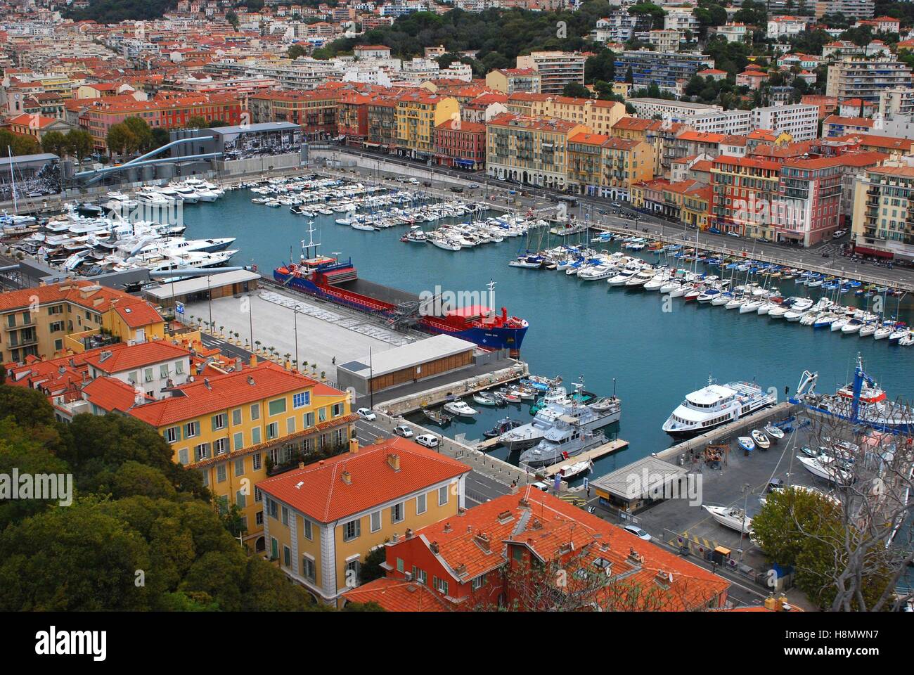 View from the hill Colline du Château over the harbour of Nice. Harbour basin Lympia for sport boats and yachts. Also a pier for coal freighter. | usage worldwide Stock Photo