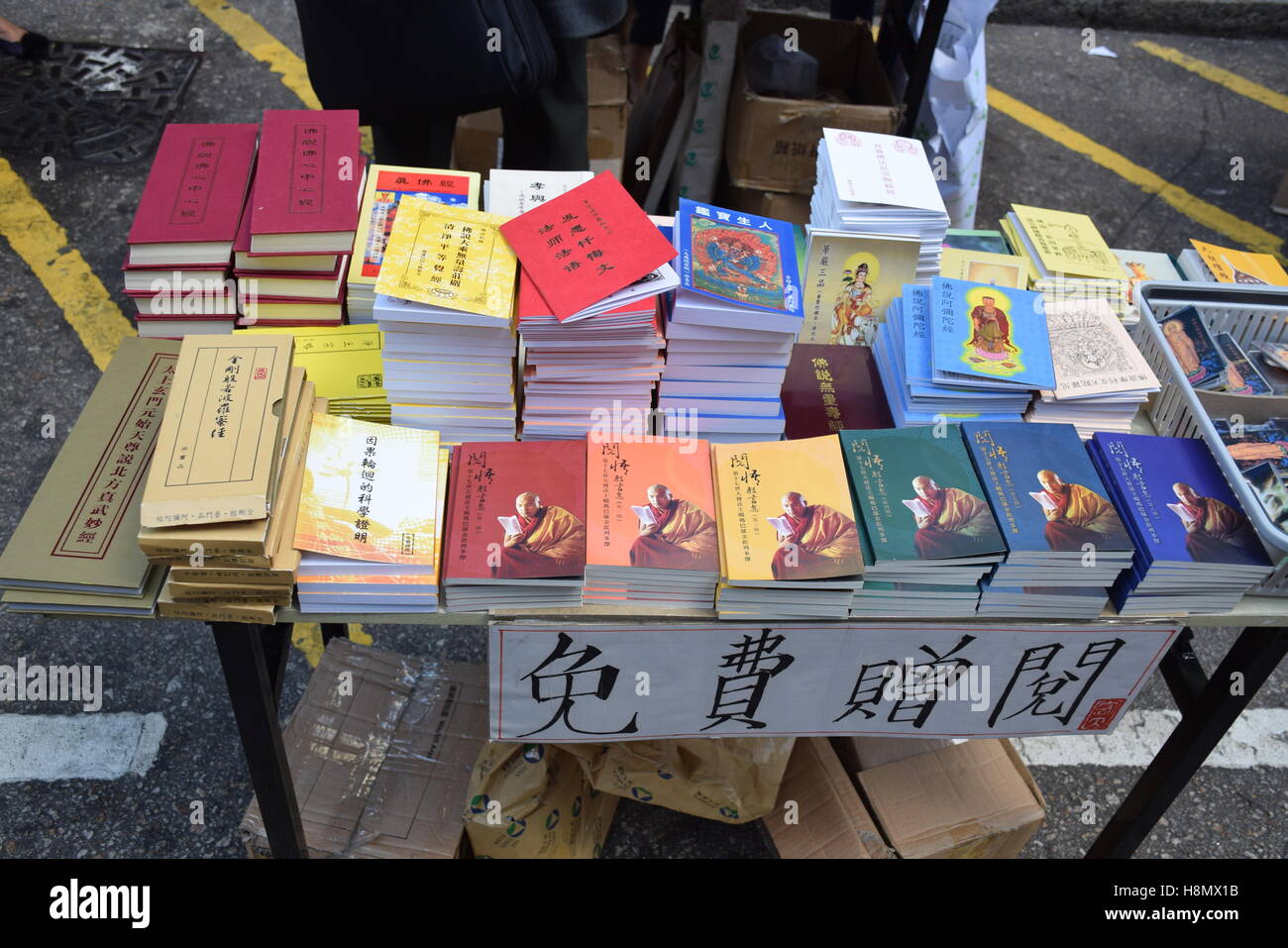 Colorful chinese books in a stall on the streets of Hong Kong, China