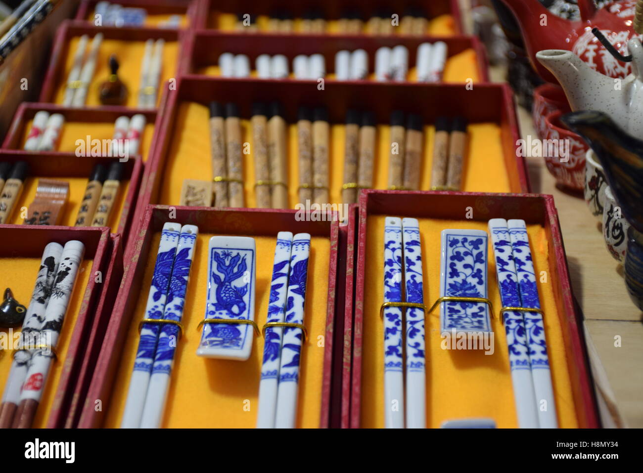Typical chinese chopsticks in a stall of a market in Hong Kong Stock Photo