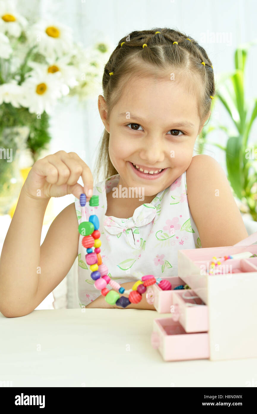 Cute Little girl with beads Stock Photo Alamy