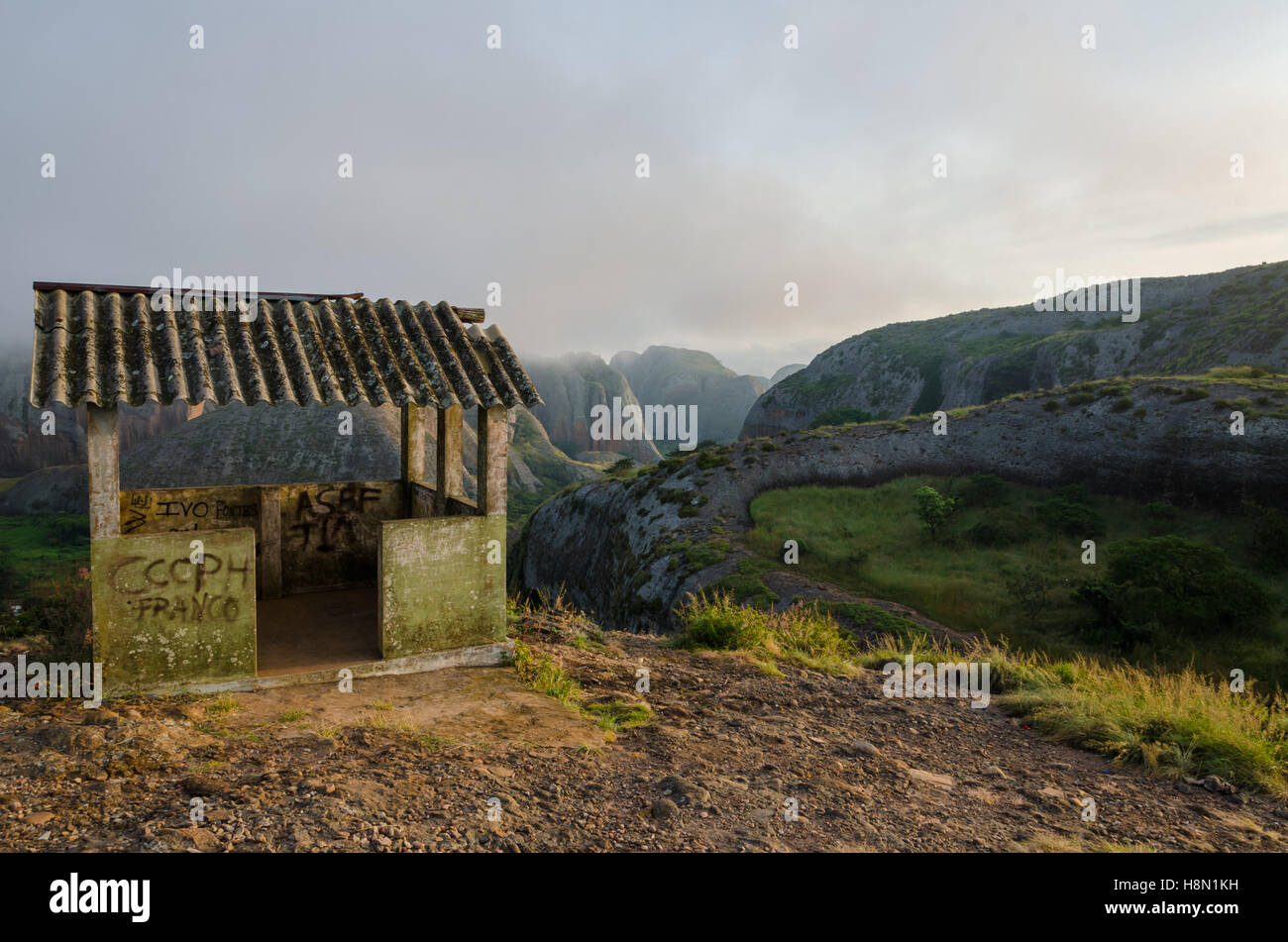 Fog and concrete hut at Black Rocks of Pungo Andongo or Pedras Negras in Angola. These unusual rock formations are of much darke Stock Photo