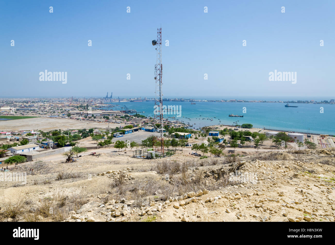 Radio antenna with the sea and town Lobito, Angola in background. Desert scenery. Stock Photo