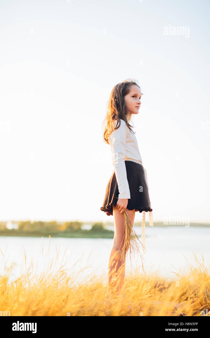 Child standing in field hi-res stock photography and images - Alamy