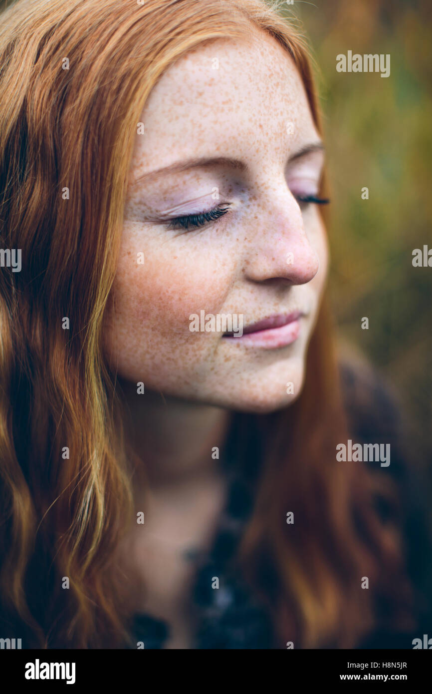Portrait of girl (16-17) with eyes closed Stock Photo