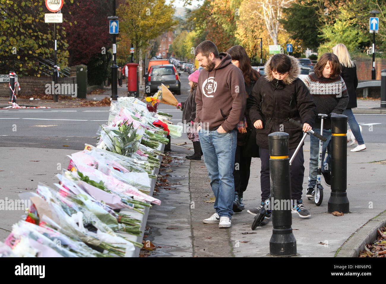Members of the public lay flowers at the scene of last week's tram crash in Croydon, south London UK Stock Photo