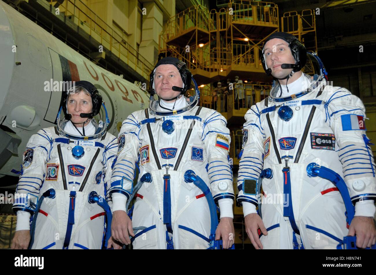 NASA International Space Station Expedition 50-51 Soyuz MS-03 prime crew members (left to right) astronaut Peggy Whitson, Russian cosmonaut Oleg Novitskiy of Roscosmos, and astronaut Thomas Pesquet of the European Space Agency prepare for their Sokol launch and entry suit pressure tests during a fit check dress rehearsal at the Baikonur Cosmodrome Integration Facility November 2, 2016 in Baikonur, Kazakhstan. Stock Photo