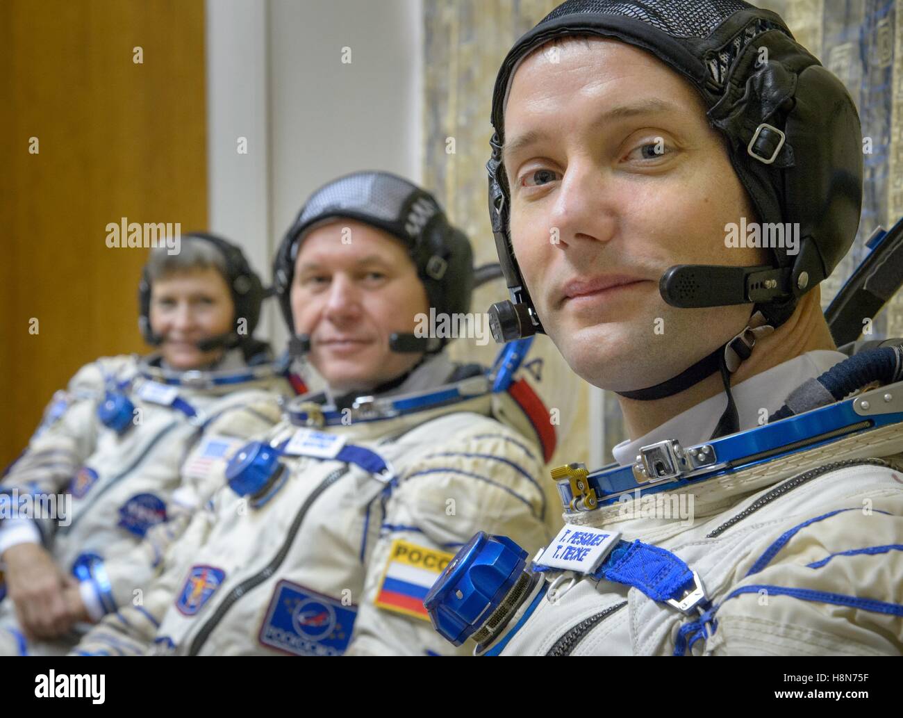 NASA International Space Station Expedition 50 Soyuz MS-03 prime crew astronauts (L-R), American astronaut Peggy Whitson, Russian cosmonaut Oleg Novitskiy of Roscosmos, and Thomas Pesquet of the European Space Agency prepare for their qualification exams October 25, 2016 in Star City, Russia. Stock Photo