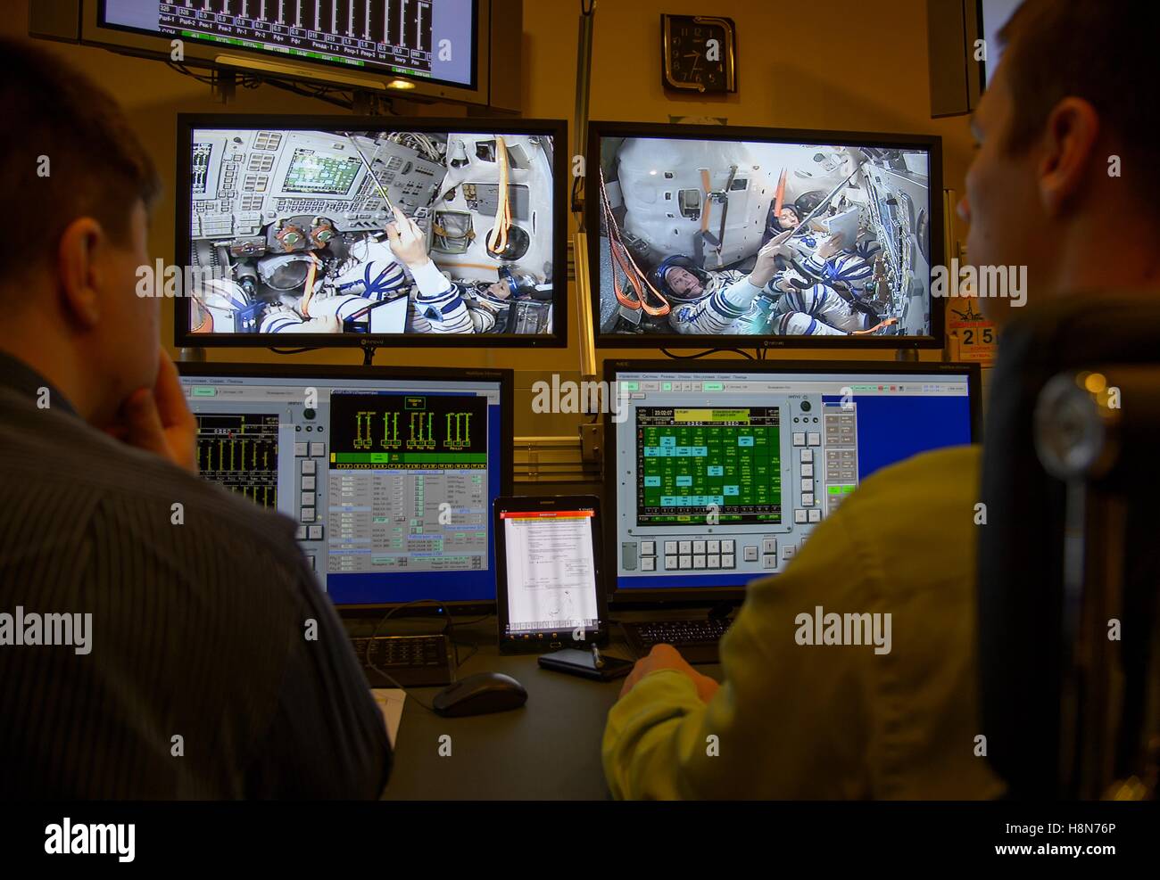 Ground control operators watch NASA International Space Station Expedition 50 Soyuz MS-03 prime crew members French astronaut Thomas Pesquet of the European Space Agency, Russian cosmonaut Oleg Novitskiy of Roscosmos, and American astronaut Pegg Whitson on control room monitors during the Soyuz simulator final qualification exams at the Gagarin Cosmonaut Training Center October 25, 2016 in Star City, Russia. Stock Photo