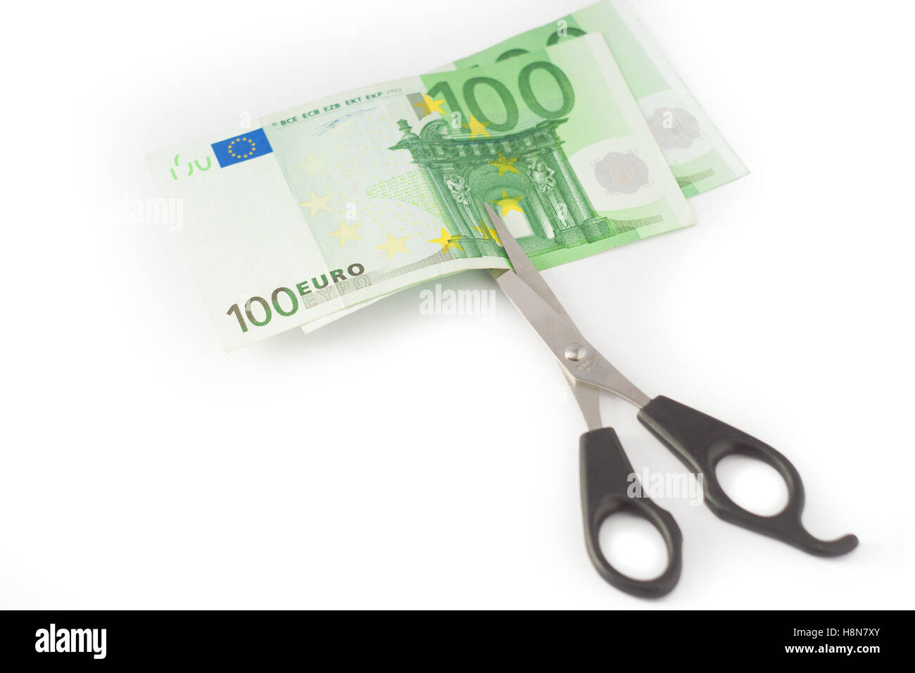 Money Cutter Money cutting financial savings budget Stock Photo - Alamy