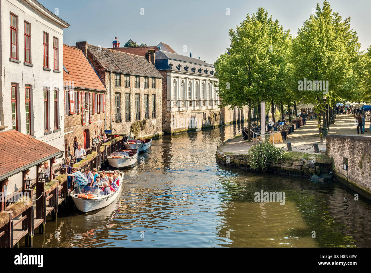 People Leaving Boats On The Canal Bruges Belgium Stock Photo