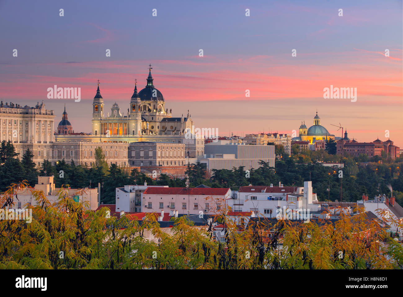Image of Madrid Skyline with Santa Maria la Real de La Almudena Cathedral and the Royal Palace during sunset. Stock Photo