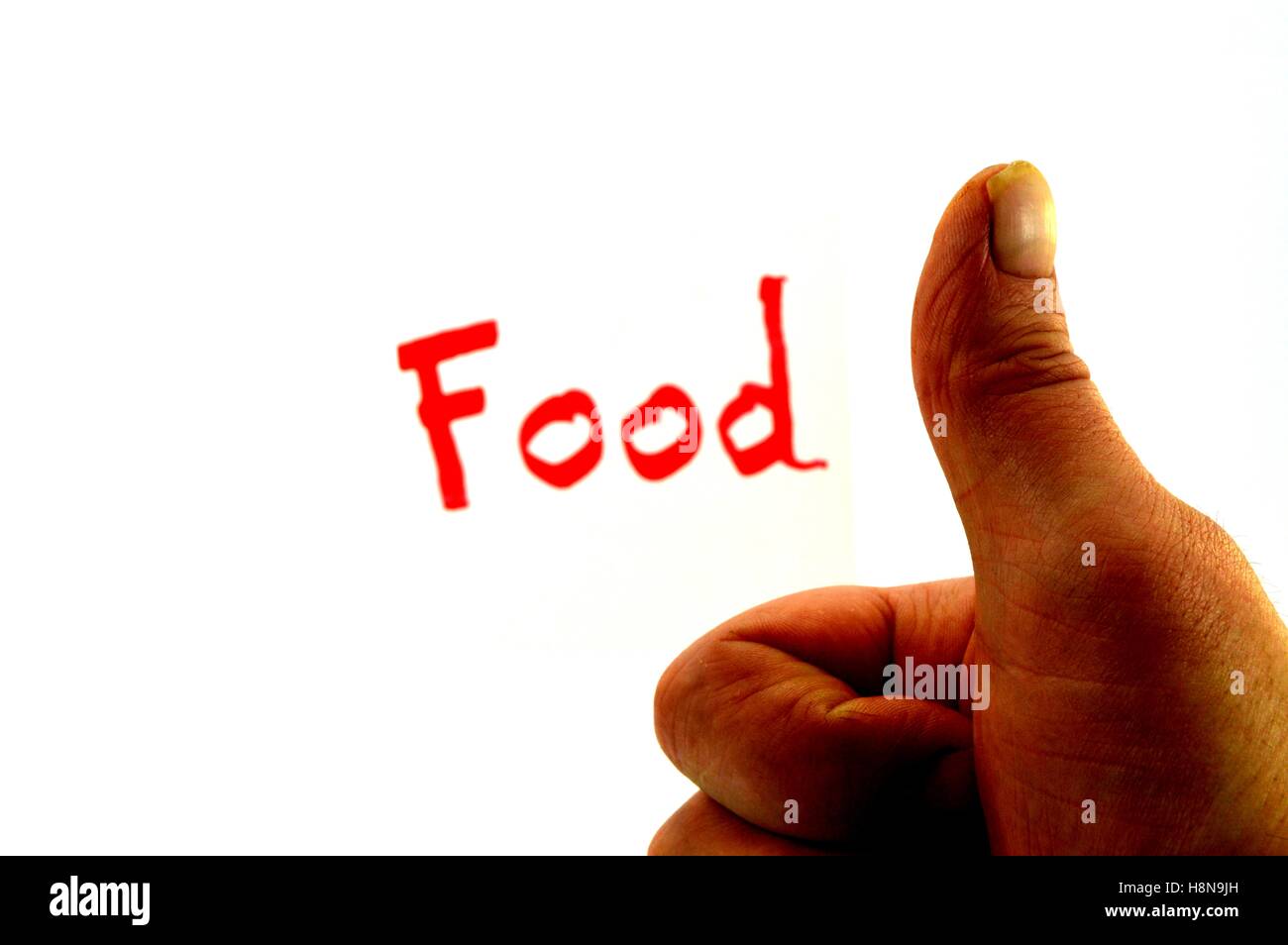 Word Food written in red letters with a thumb upward Stock Photo