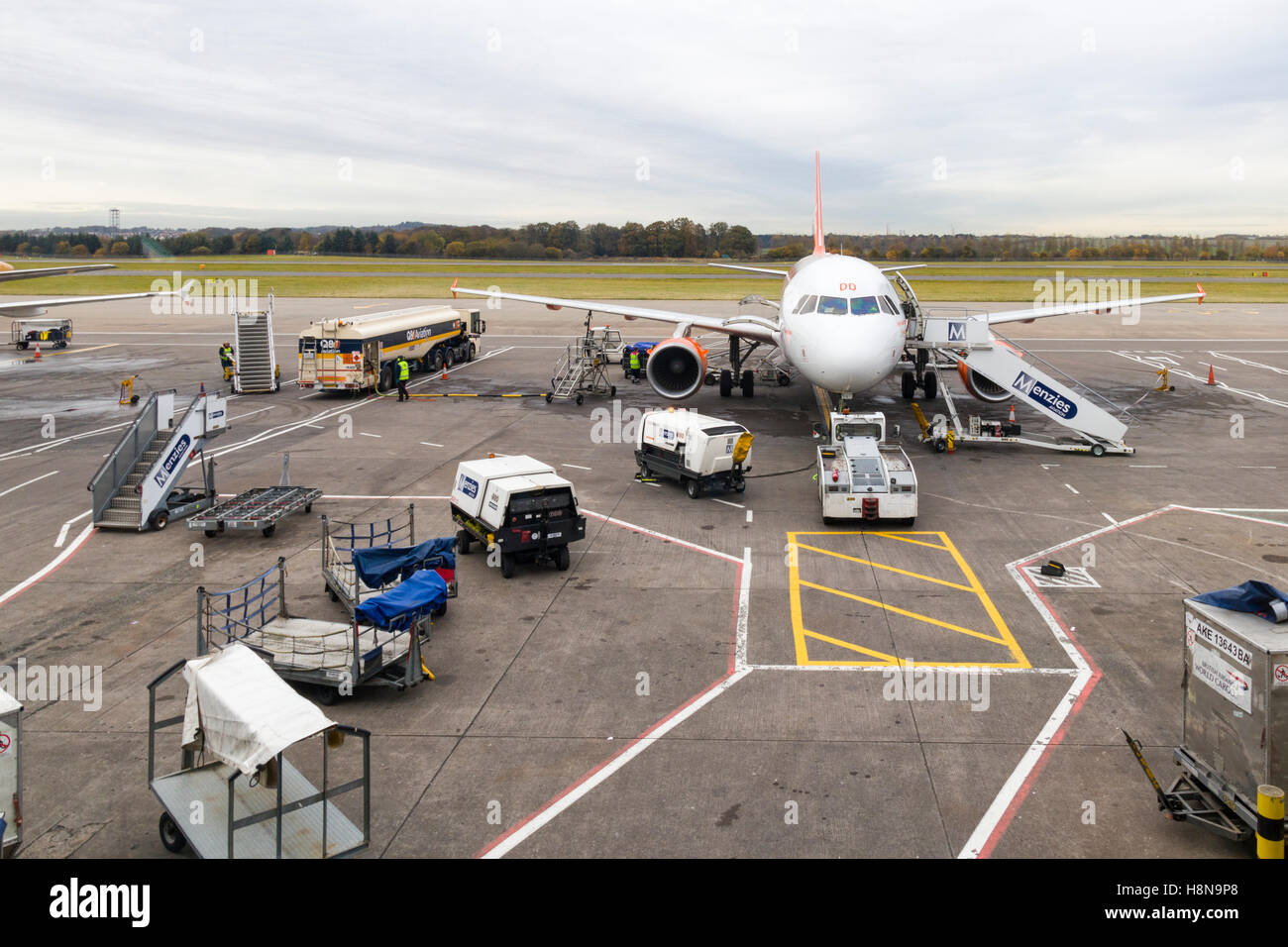 Passenger airplane refuelling and preparing for departure at Edinburgh Airport, Scotland, UK  Model Release: No.  Property Release: No. Stock Photo