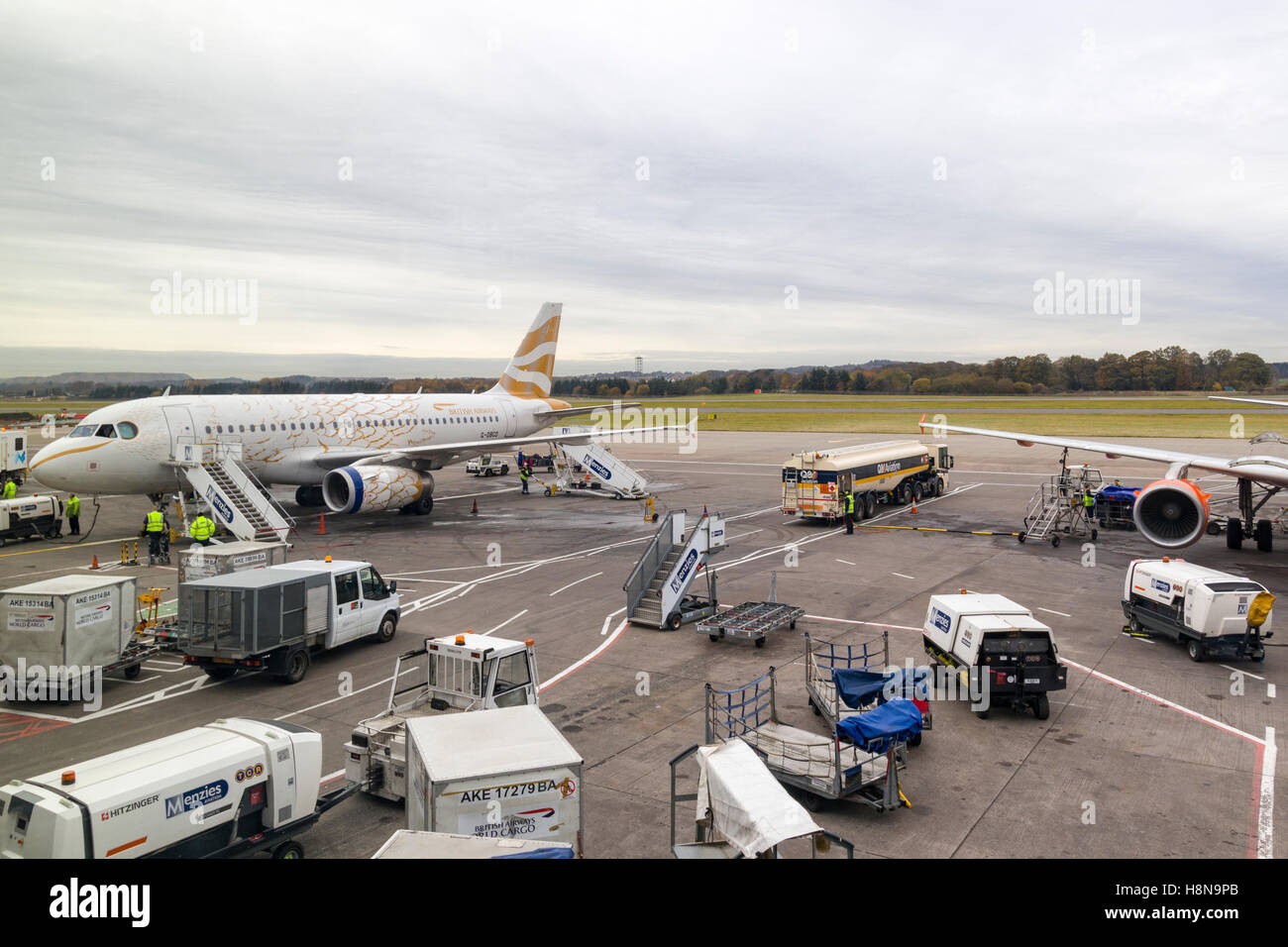 Passenger airplane refuelling and preparing for departure at Edinburgh Airport, Scotland, UK  Model Release: No.  Property Release: No. Stock Photo